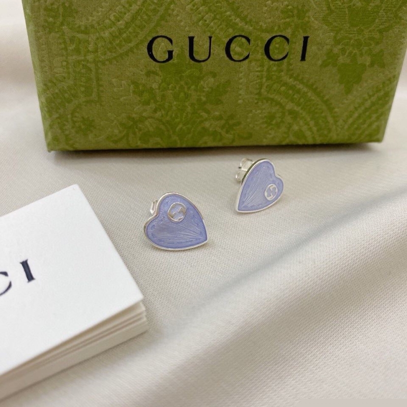 G*u*i earrings